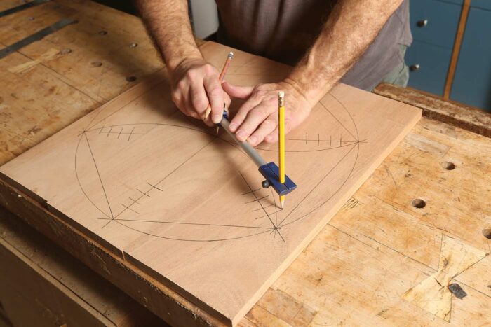 Drawing in the layout of an octagon on a piece of wood.